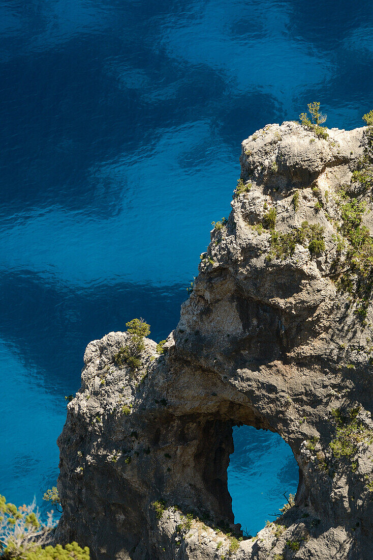 Rock arch on the mountainous coast above the sea, Golfo di Orosei, Selvaggio Blu, Sardinia, Italy, Europe