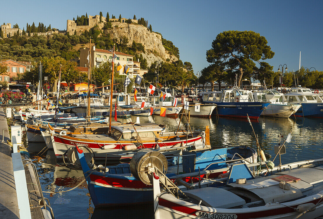 Boats in the port of Cassis with castle, Bouches-du-Rhone, Cote d Azur, French Riviera, Mediterranean Sea, Provence, France, Europe