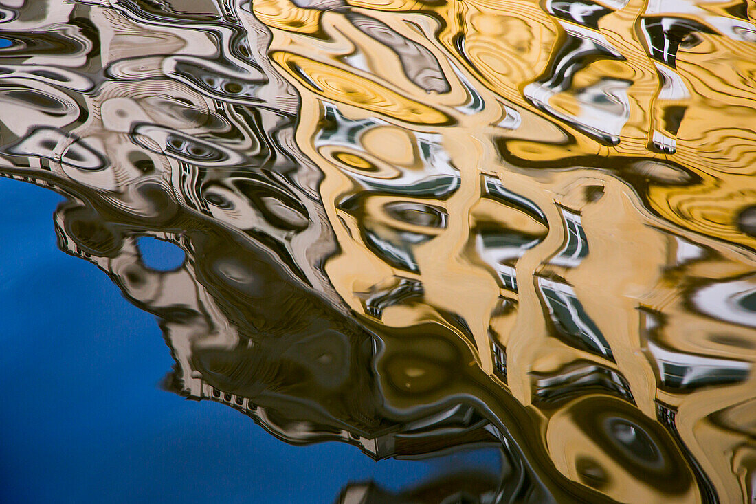 Reflection of colorful buildings in a canal near Ketelvest Marina, Ghent, Flemish Region, Belgium