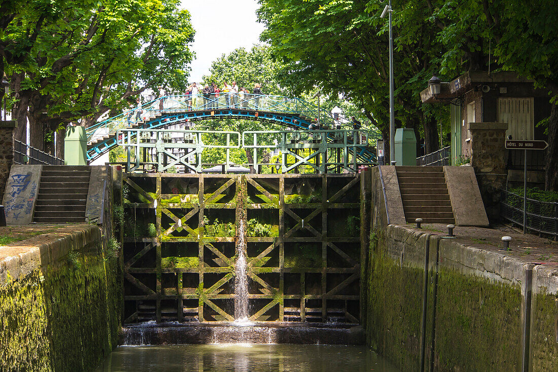 France, Paris, lock on Canal St Martin, footbridge in background