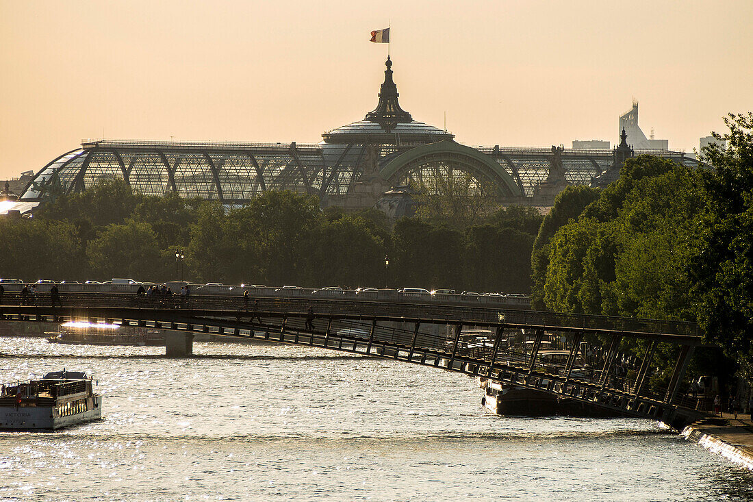 France, Paris, Grand Palais and its glass roof and Solferino footbridge over the Seine