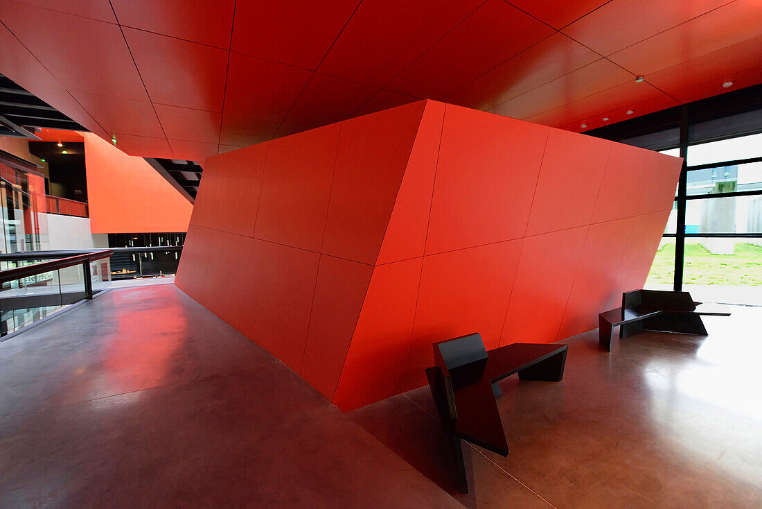Europe,France, within the Frac Rennes, red wall and two benches black (architect Odile Decq)