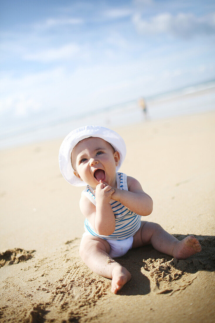A 7 month baby boy on the beach