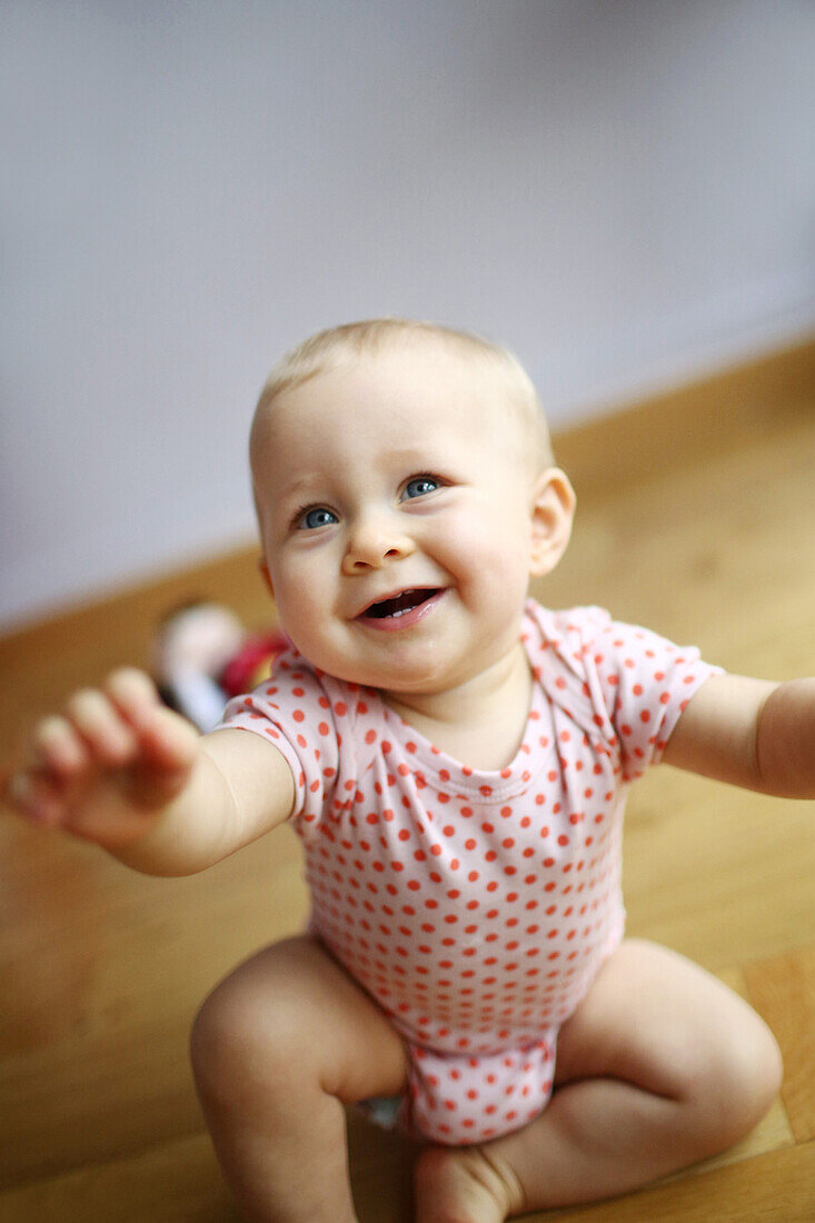 Portrait of a 1 year baby girl in her room