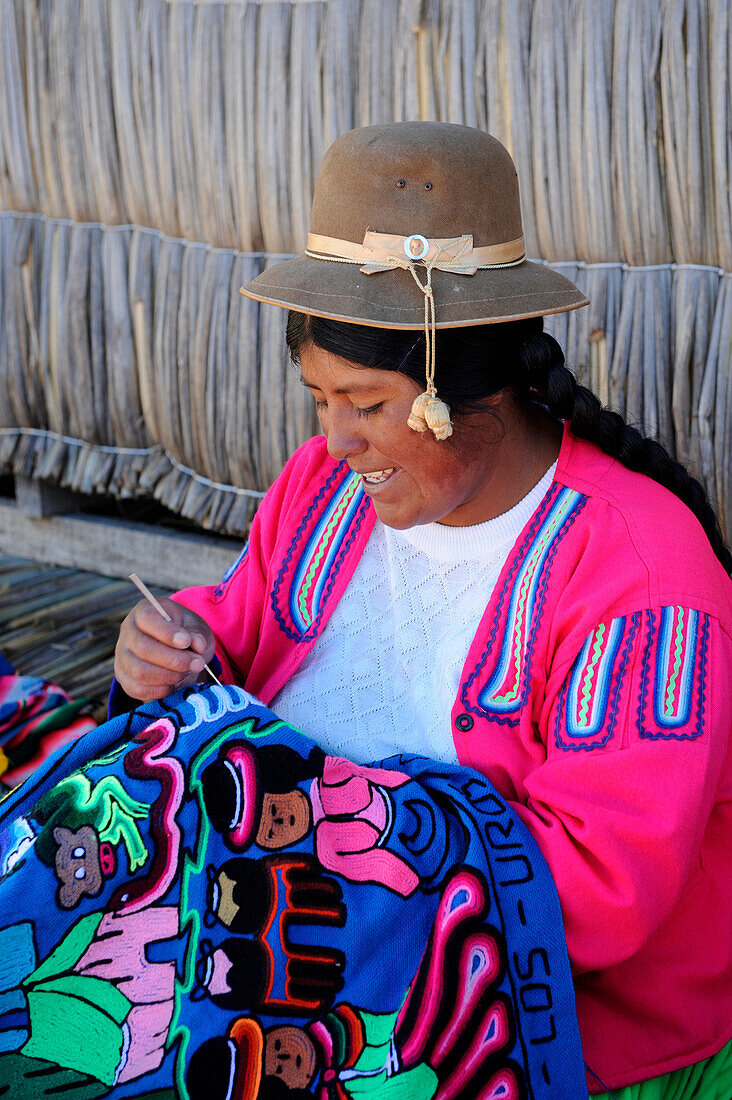 Woman weaving in a village of Titicaca lake in Peru,South America