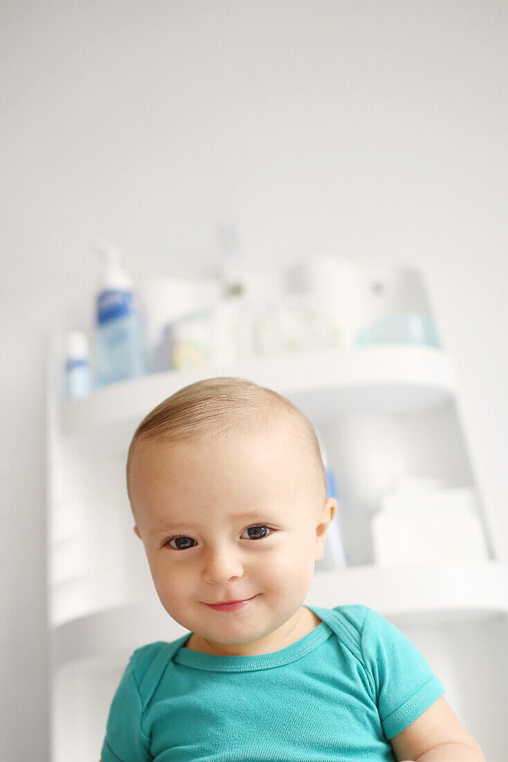 Baby smiling on a changing table