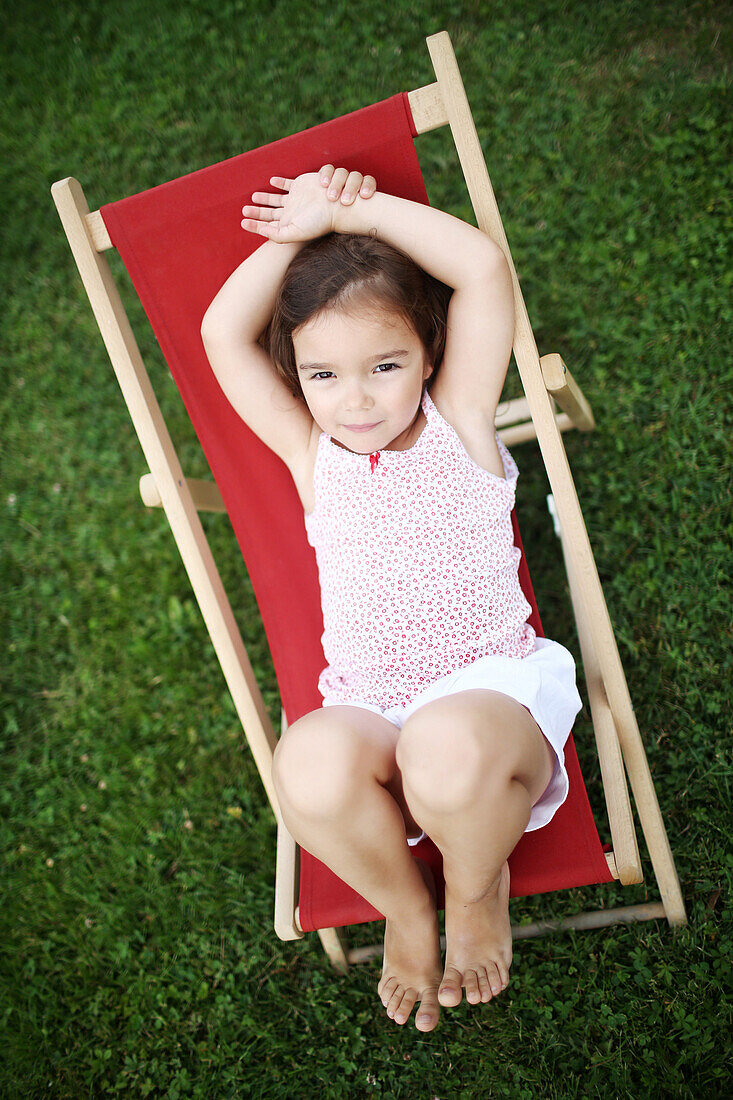 of a 4 years old girl on a lounge chair for child