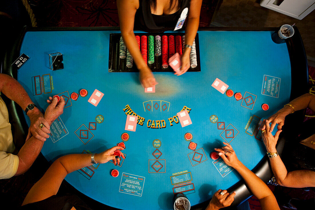 People playing poker in casino