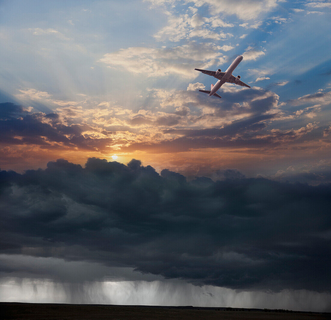 Airplane flying in dramatic sky