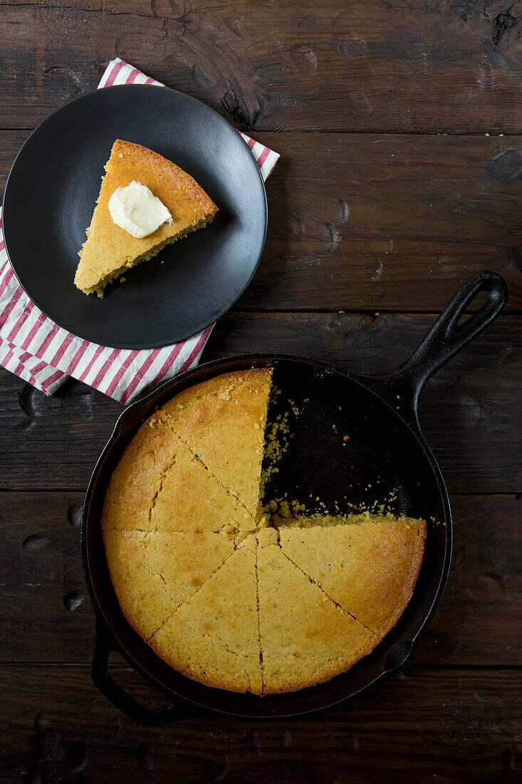 Cornbread in Skillet and Slice of Cornbread with Butter