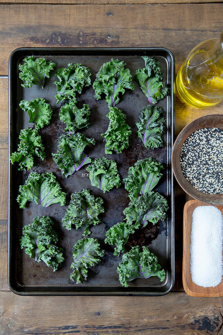 Kale Leaves on Baking Tray Being Prepared for Oven