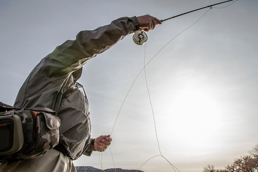 Man Casting Fly-fishing Rod, Low Angle View