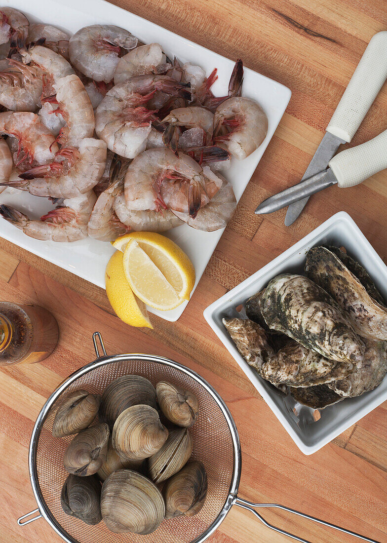 Raw Shrimp, Clams and Oysters with Lemons, High Angle View