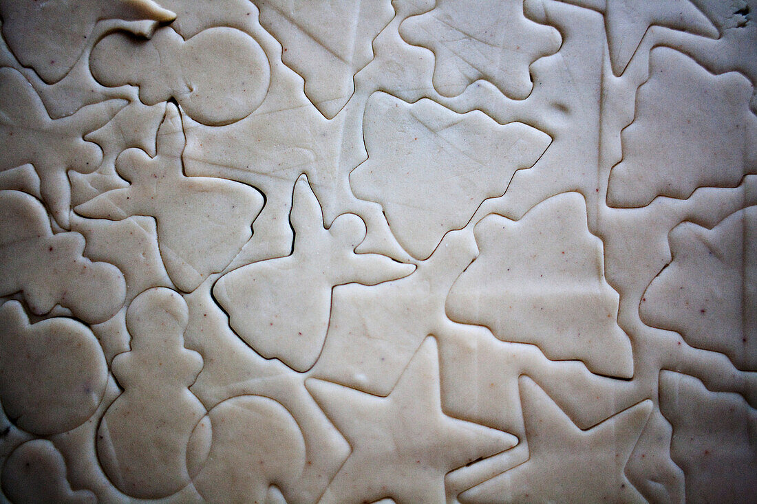 Christmas Shapes Outlined in Cookie Dough Using Cookie Cutters, High Angle View