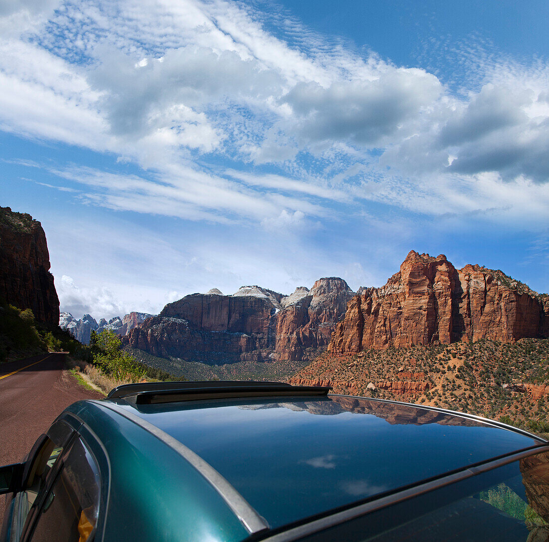 Car on Scenic Road with Mountains in Background, Utah, USA