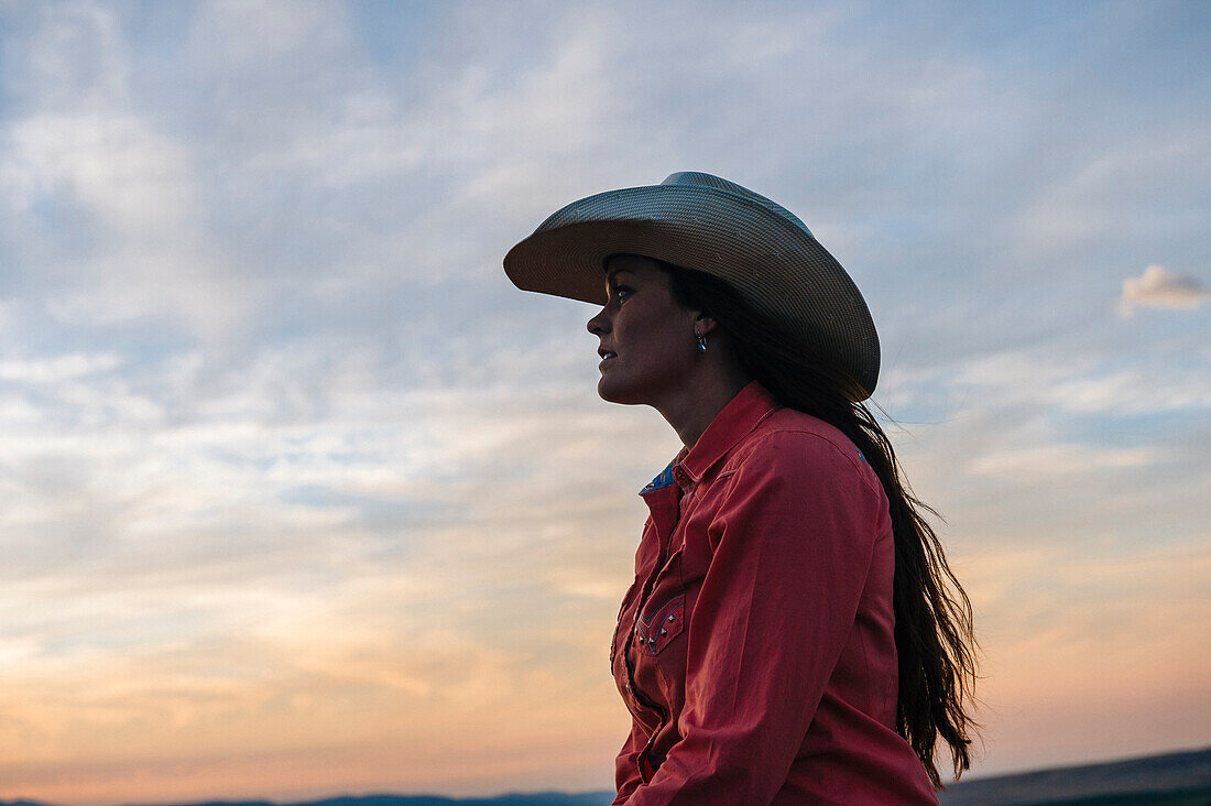 Caucasian woman under sunset sky, Joseph , Oregon, USA