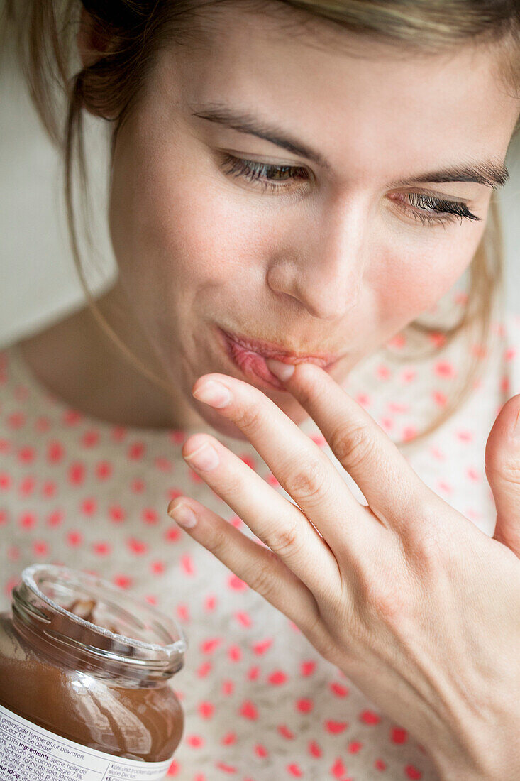 Woman eating a chocolate