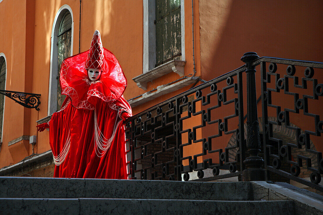 Italy, carnival of Venice, mask of Venice on a bridge
