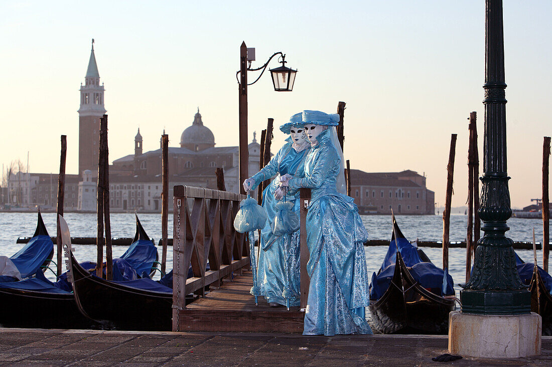 Italy, Venice carnival, Masks in front of the Venetian lagoon and San Gorgio church