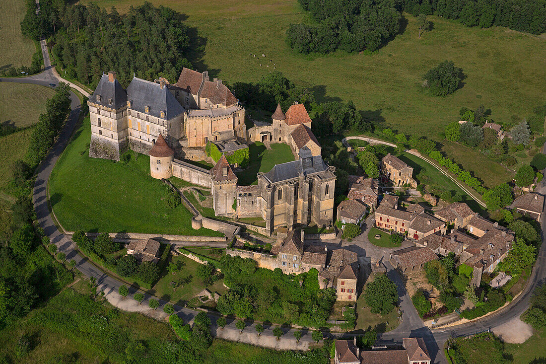France, Dordogne (24), Biron village dominated by the castle twelfth century listed historical monument (aerial view)