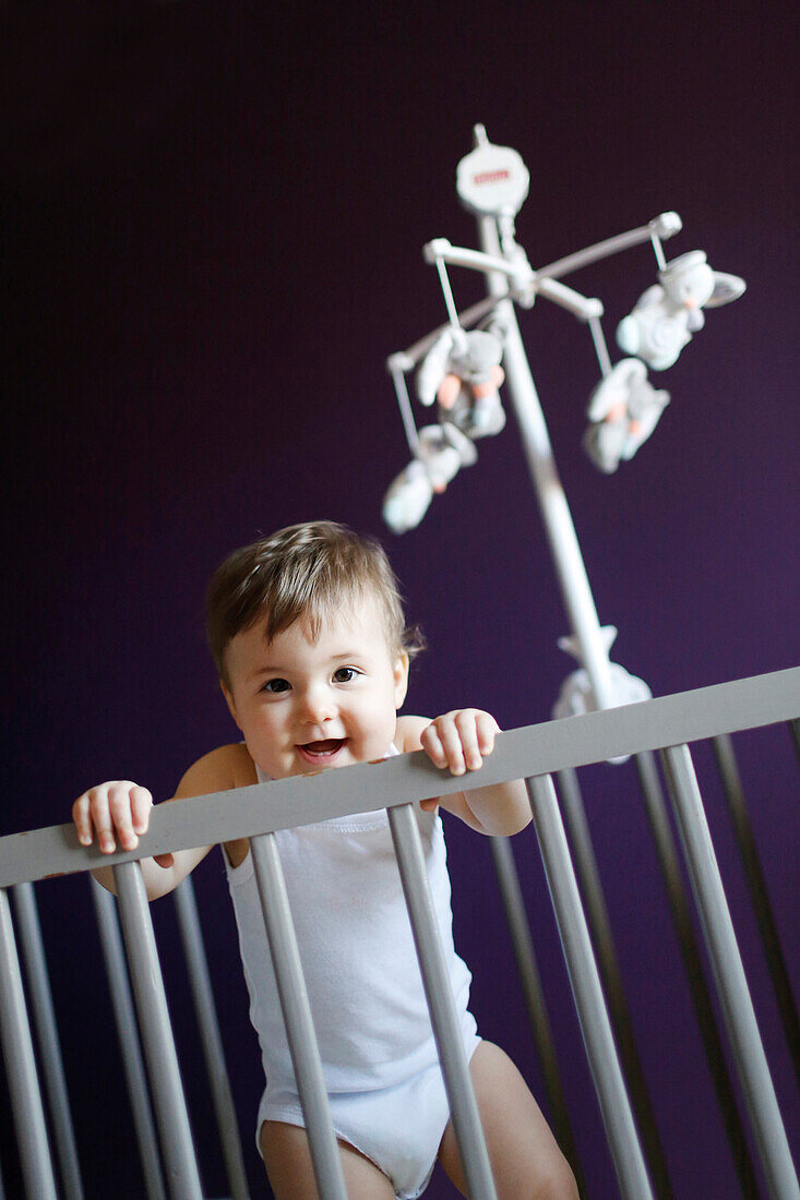 A baby girl in her crib