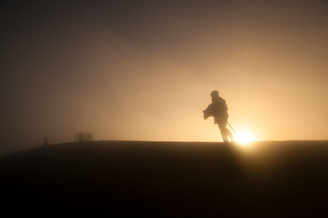 Woman walking in the fog atop Volcan Acatenango, Guatemala, Central America