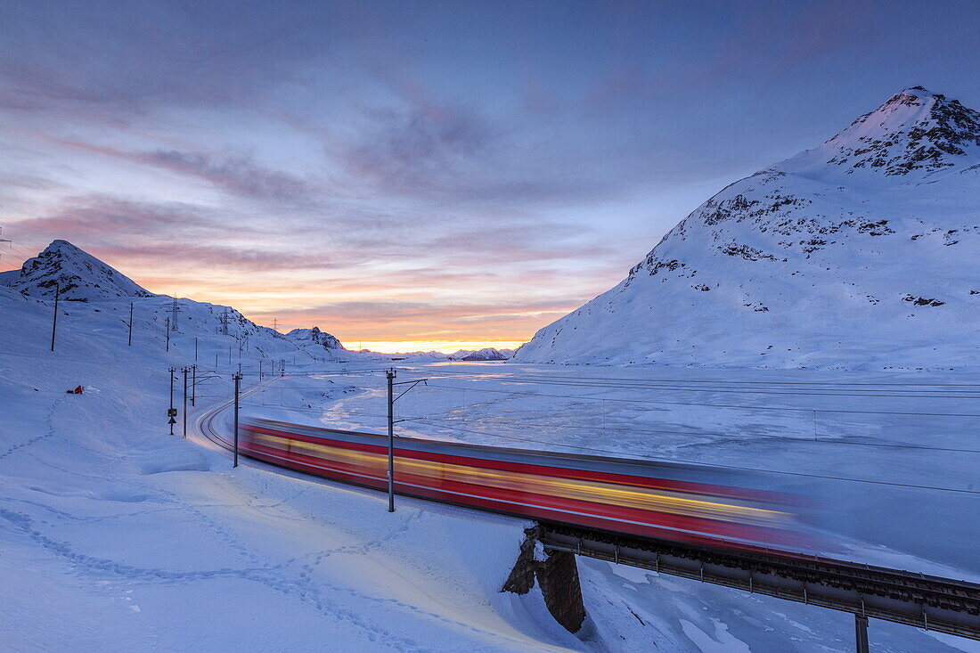 The Bernina Express red train, UNESCO World Heritage Site, Graubunden, Swiss Alps, Switzerland, Europe