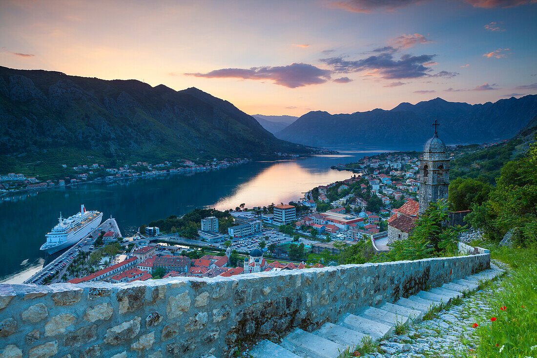 Elevated view over Kotor's Stari Grad (Old Town) and The Bay of Kotor at sunset, Kotor, UNESCO World Heritage Site, Montenegro, Europe