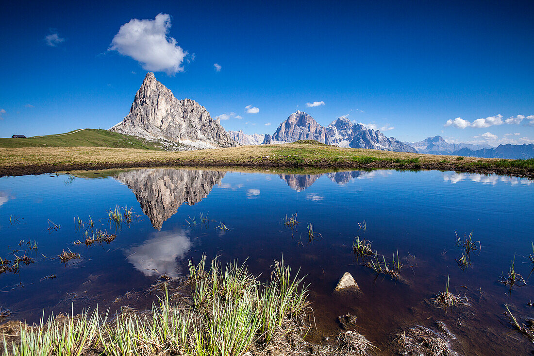 The Gusela peak and the Tofane Group by Cortina D'Ampezzo reflecting in the lake by Passo Giau, Veneto, Italy, Europe