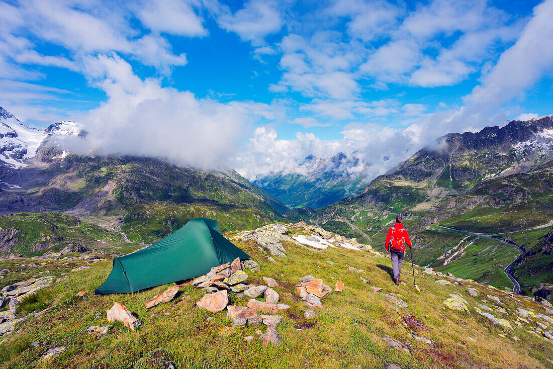 Hiker and camp site, Sustenpass (Susten Pass), Swiss Alps, Switzerland, Europe