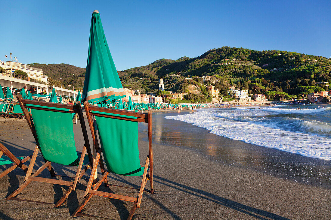 Sun umbrella and chair at the beach of Levanto, Riviera de Levanto, Cinque Terre, Liguria, Italy, Europe