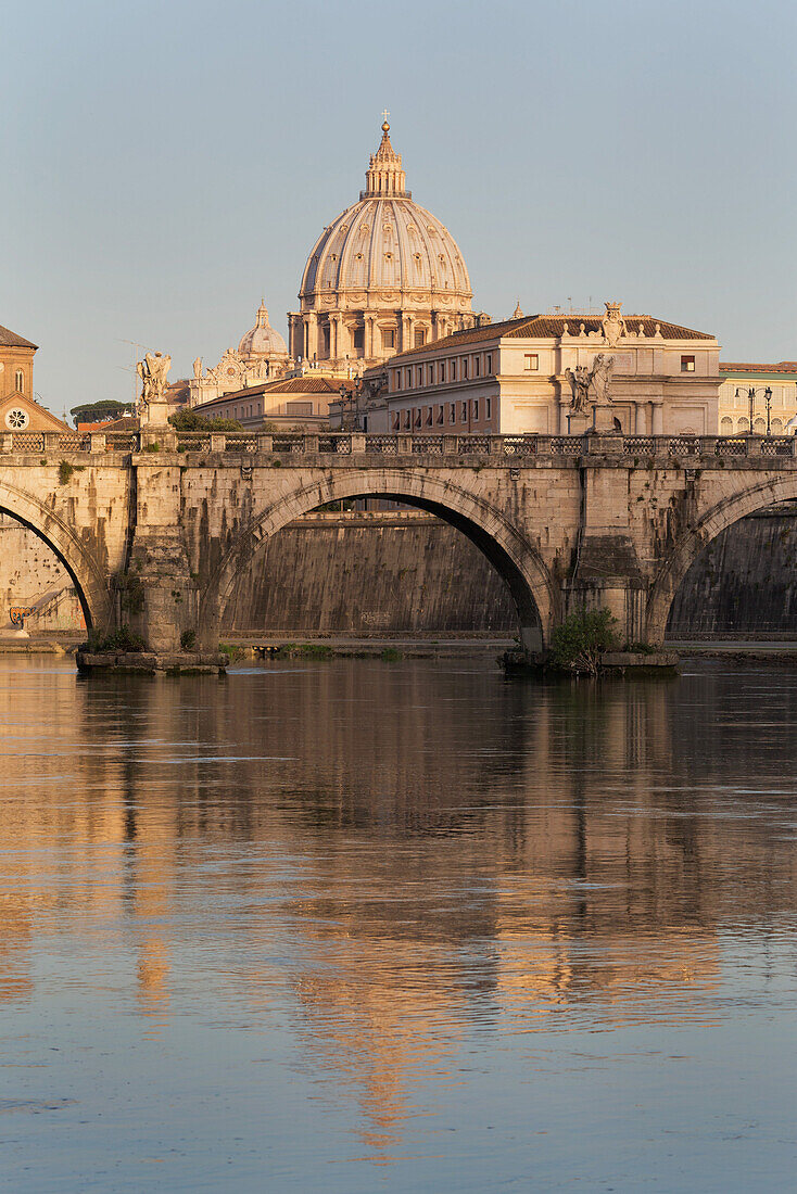 Ponte Sant' Angelo bridge and St. Peter's Basilica reflected in the River Tiber, Rome, Lazio, Italy, Europe