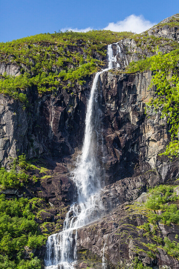 Ice melt waterfall on the Olden River as it flows along Briksdalen, Olden, Nordfjord, Norway, Scandinavia, Europe