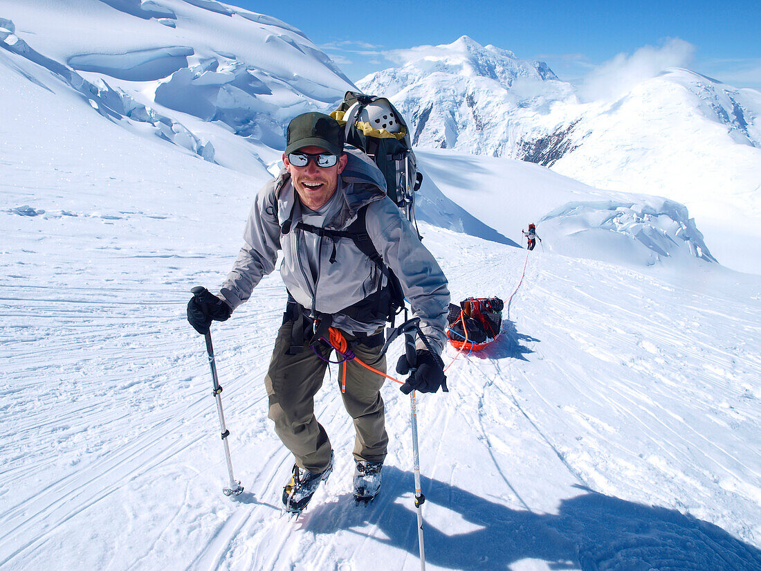 Mountain ranger Brian Scheele on this way to Windy Corner on Mount McKinley, also know as Denali, in Alaska. He is pulling a sled, that together with his heavy backpack is containing all the gear like tents, clothing and food.     Every climbing season Hi