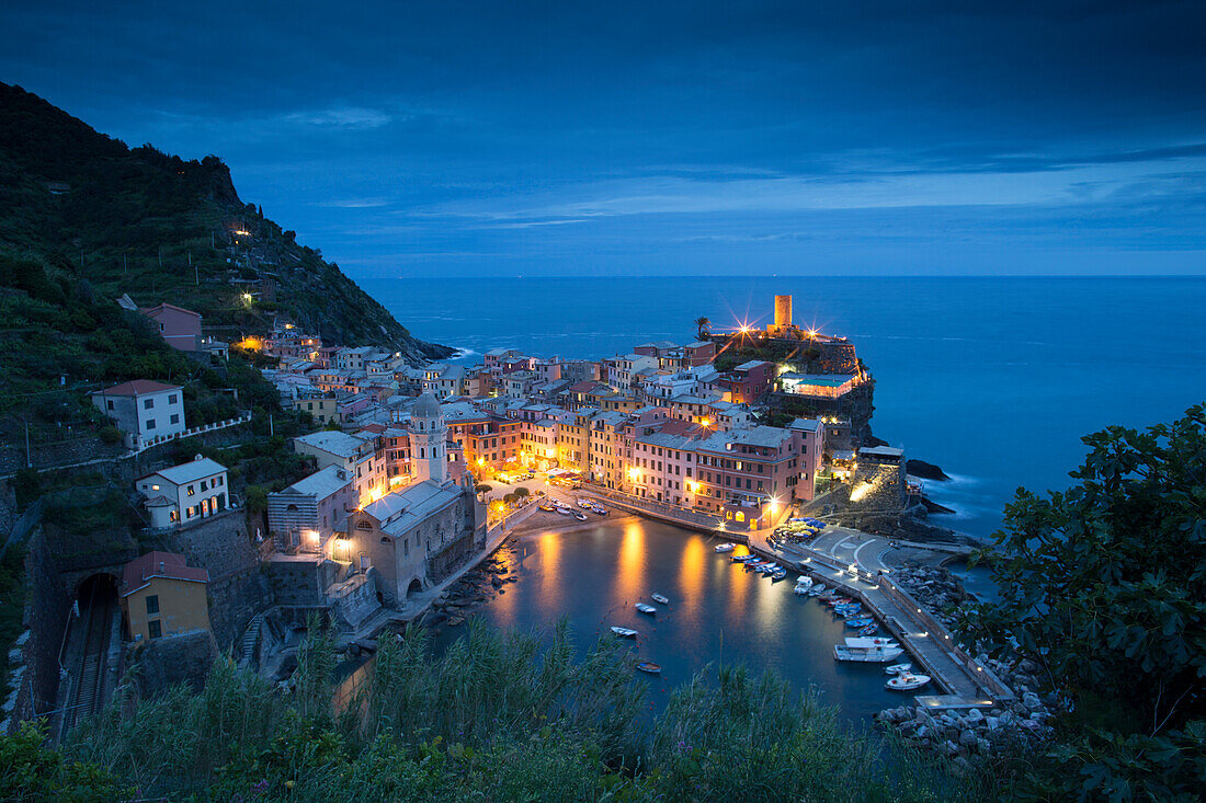 Vernazza in Italy's Cinque Terre shimmers at dusk.