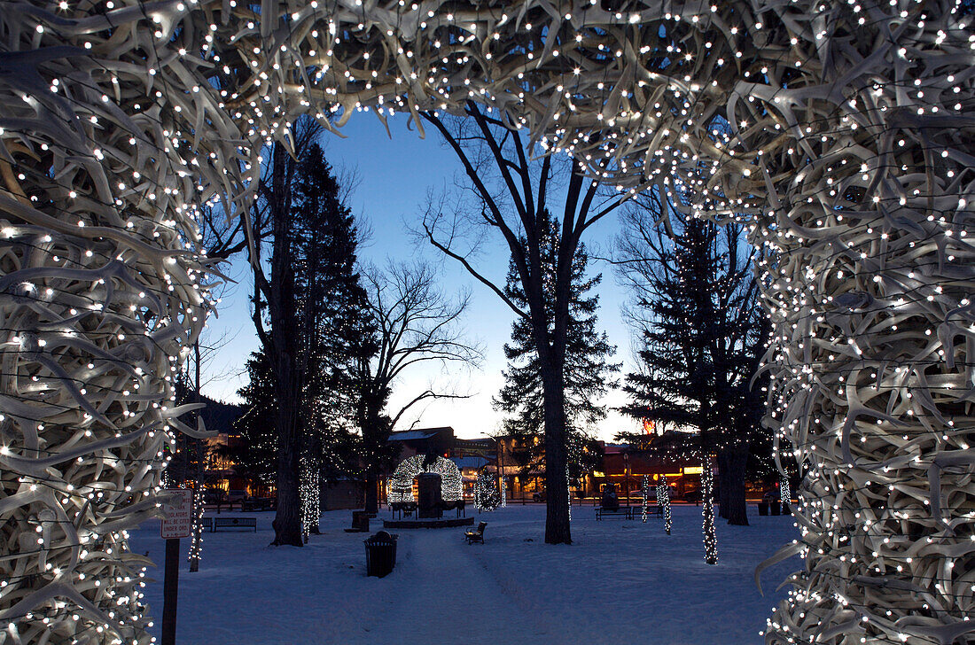 Christmas lights adorn antler arches in Jackson Wyoming's city center.