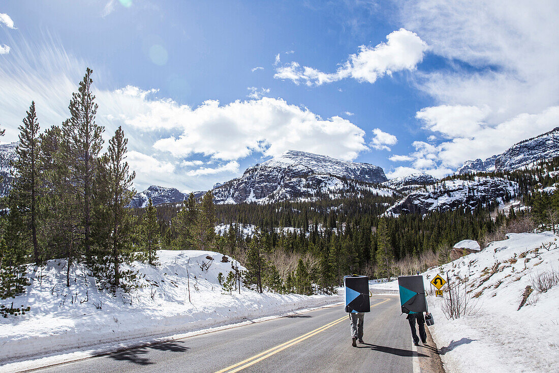 Two climbers walking in Rocky Mountain National Park, Colorado to go boulder