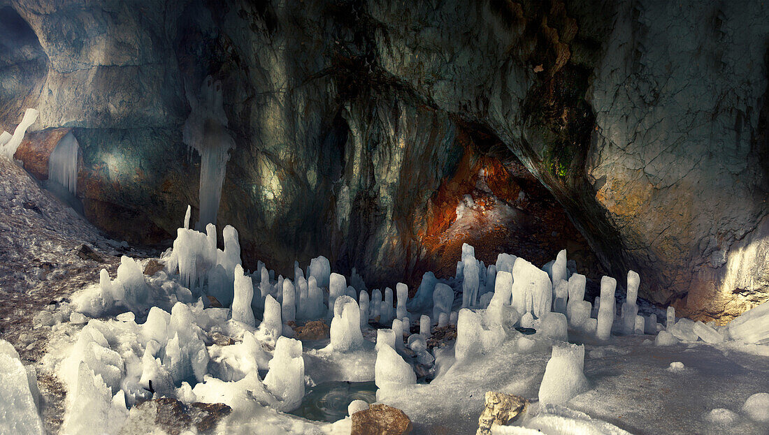 Panoramic image of ice pillars and glacial water in the middle of the Ice cave on Mount Durmitor.