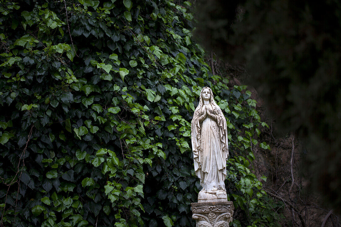 A sculpture of the Virgin Mary decorates a garde in Zahara de la Sierra, Sierra de Grazalema Natural Park, Cadiz province, Andalusia, Spain