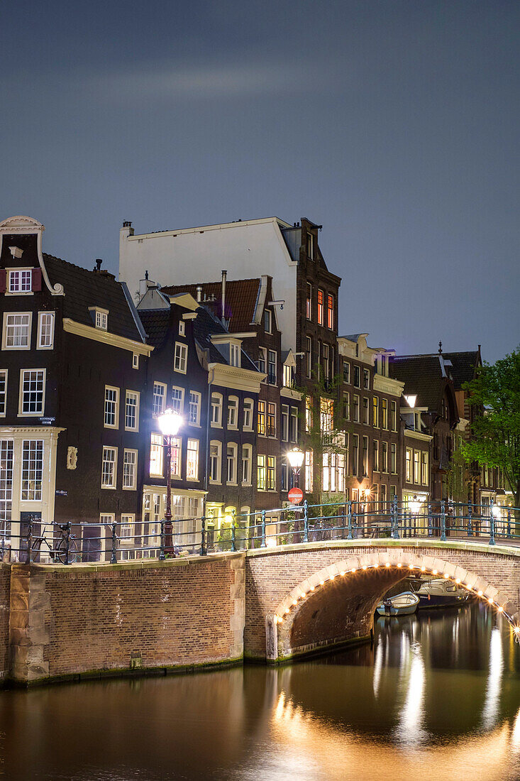 Buildings at the intersection of Keizersgracht and Reguliersgracht at night, Amsterdam, North Holland, Netherlands