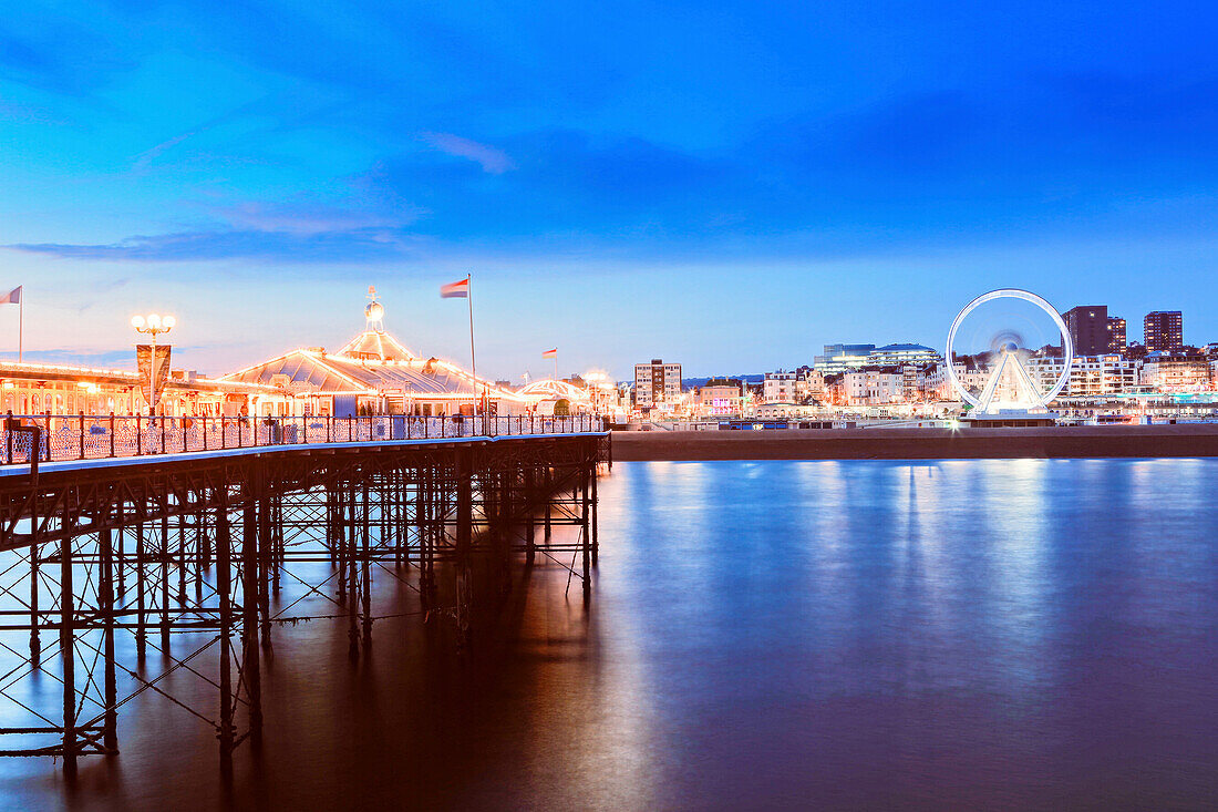 The Palace Pier (Brighton Pier) at dusk, Brighton, East Sussex, England, United Kingdom, Europe