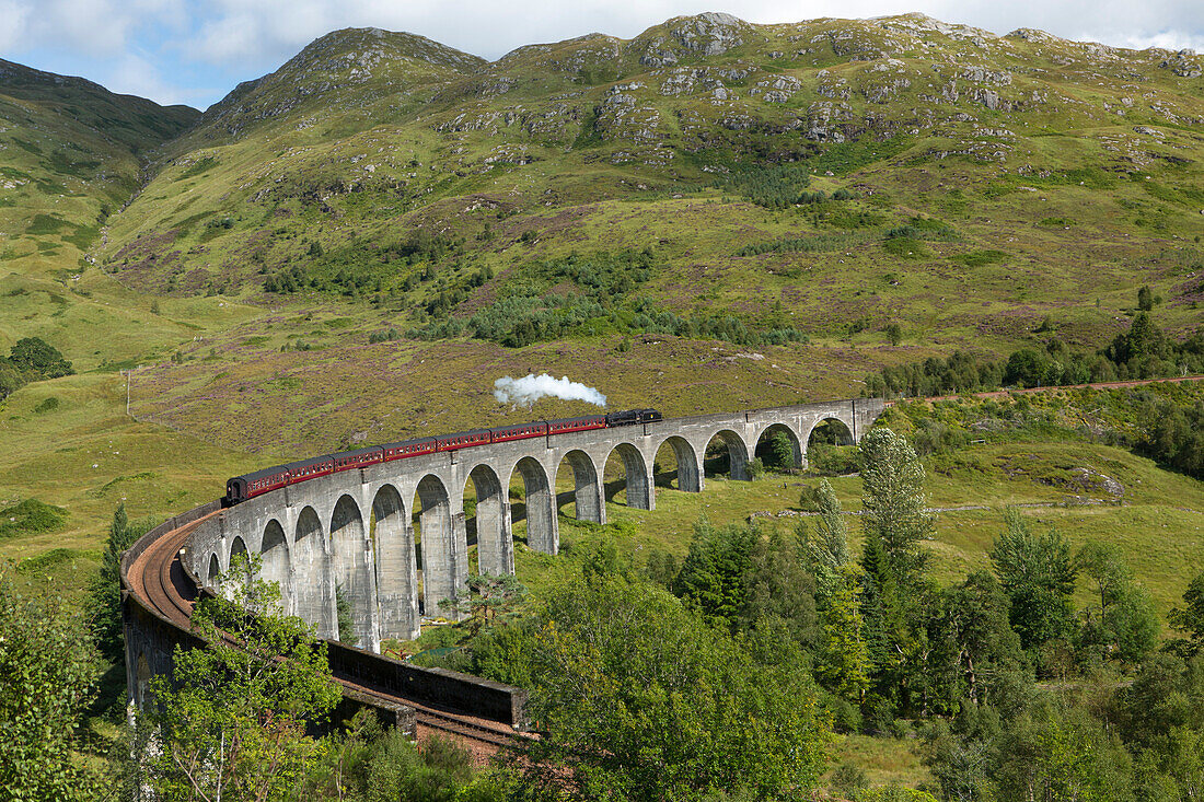 The Jacobite steam train on the Glenfinnan Viadust on the Fort William to Mallaig Railway, Highlands, Scotland, United Kingdom, Europe