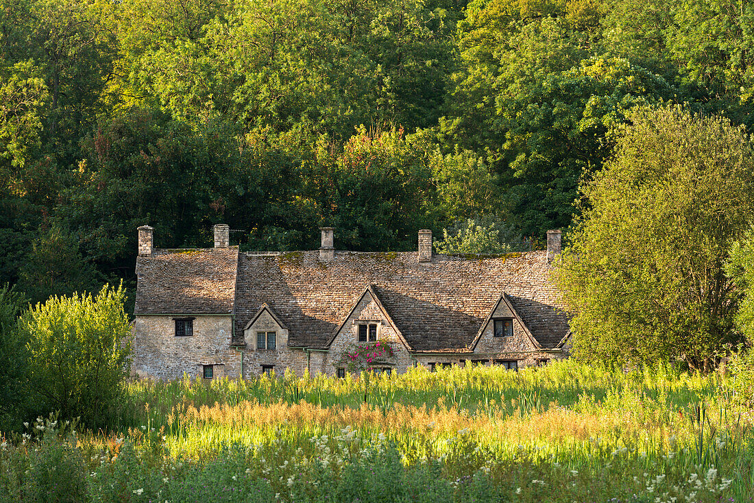 Arlington Row cottages in the Cotswold village of Bibury, Gloucestershire, England, United Kingdom, Europe