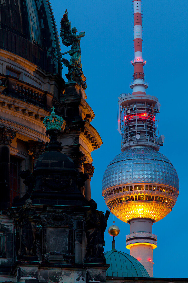 Close-up of the Berliner Dom (Cathedral) with the Television Tower in the background at night, Berlin, Germany, Europe