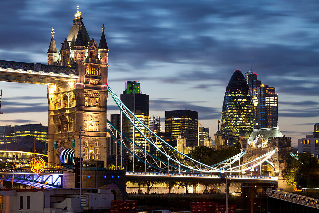 Tower Bridge and the City of London at night, London, England, United Kingdom, Europe