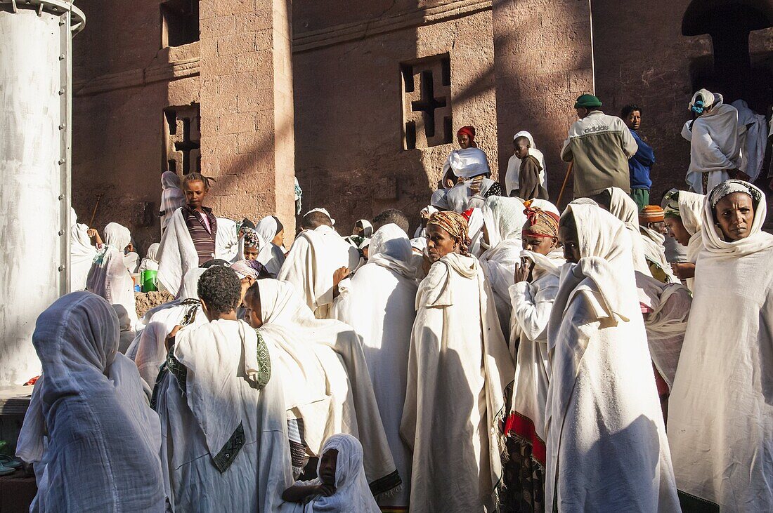 Pilgrims with the traditional white shawl attending a ceremony at the Bete Medhane Alem Church, Lalibela, Amhara region, Northern Ethiopia, Africa