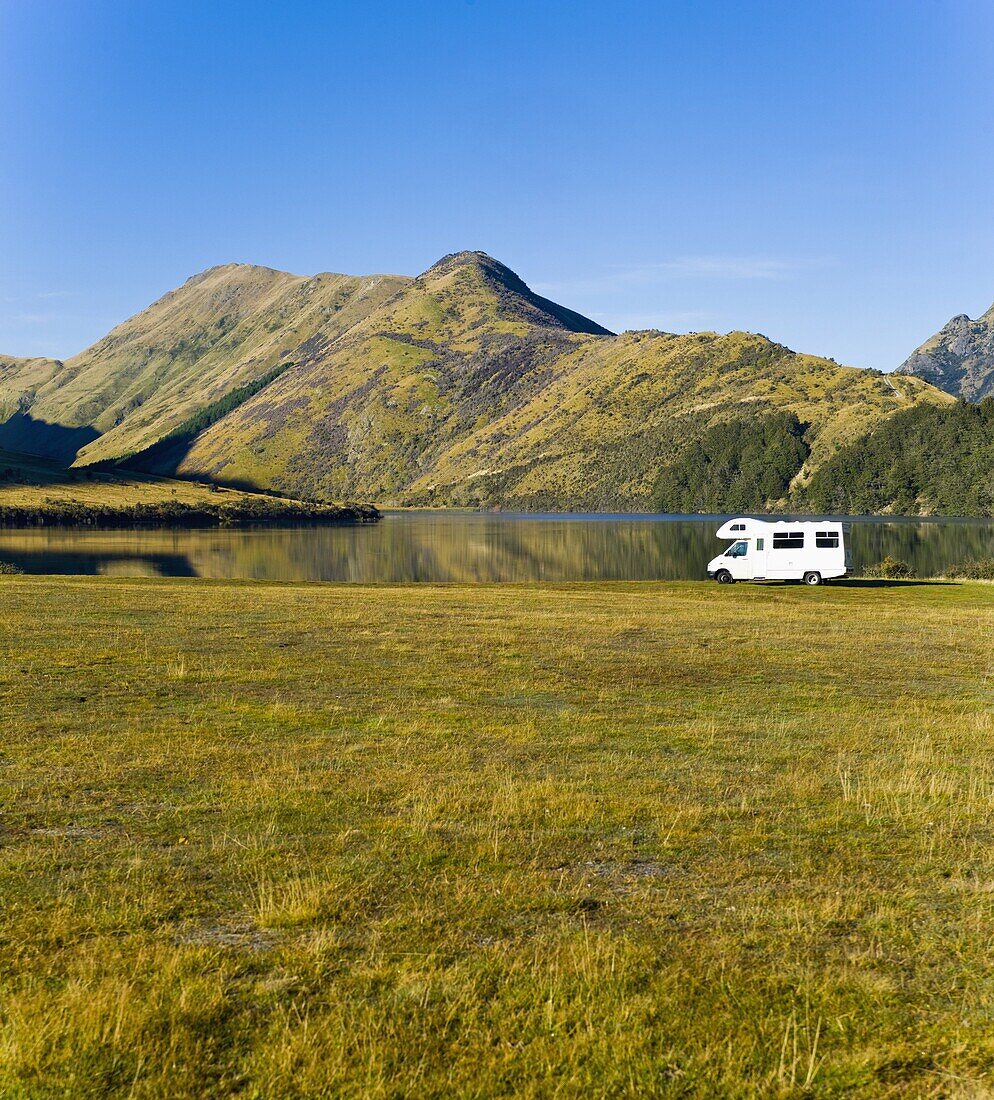 Caravan at Lake Moke Department of Conservation campsite, Queenstown, Otago, South Island, New Zealand, Pacific