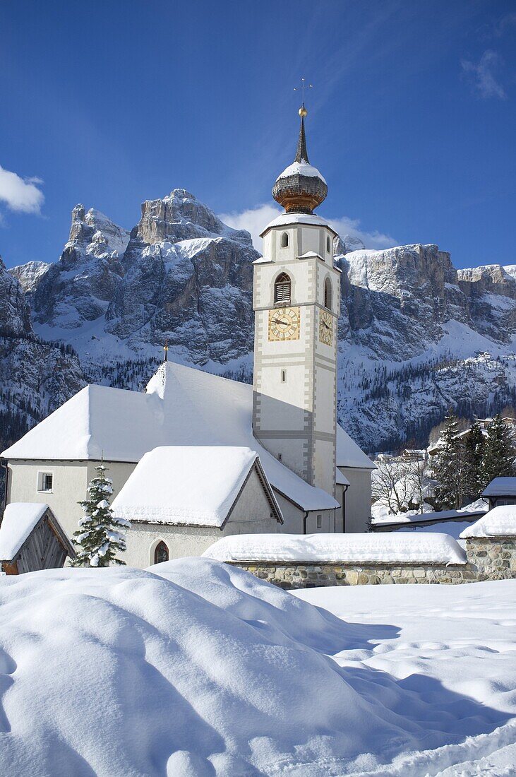 A church in Colfosco in Badia near the Sella Massif mountain range in the Dolomites, South Tyrol, Italy, Europe