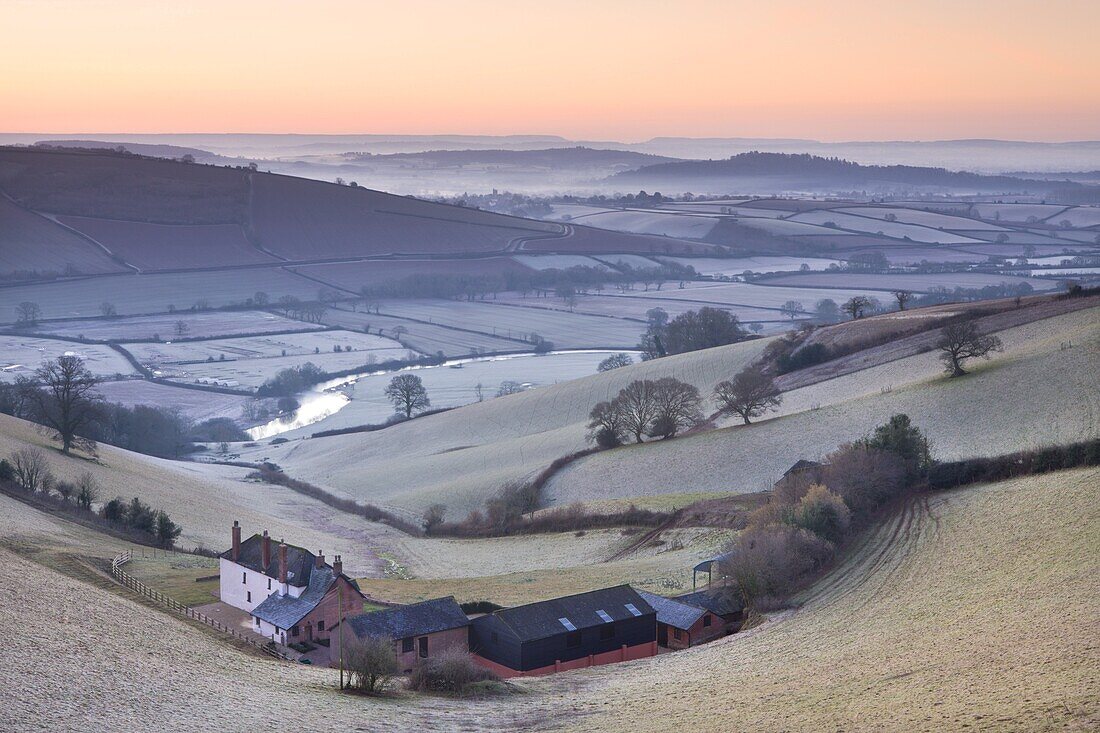 Frost coated countryside and farm buildings at sunrise, Exe Valley, Devon, England, United Kingdom, Europe