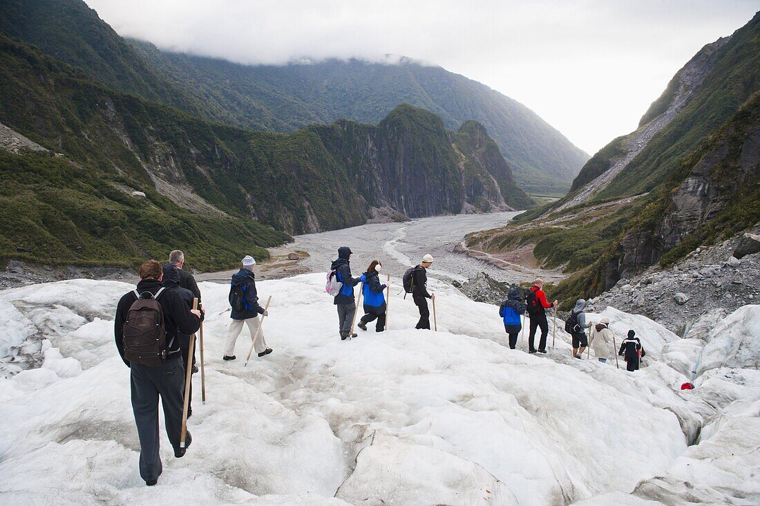 Tourists walking on Fox Glacier, Westland National Park, UNESCO World Heritage Site, South Island, New Zealand, Pacific